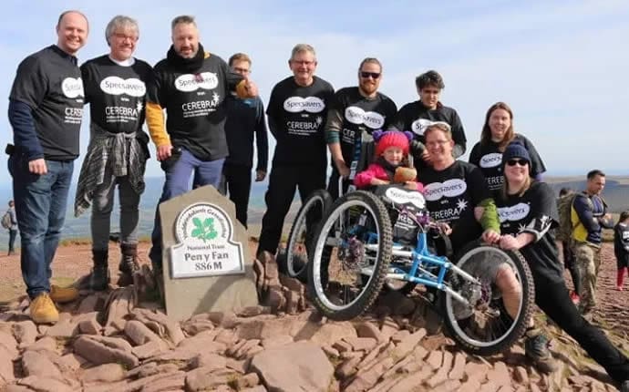 The CIC team and Imogen atop Pen y Fan, South Wales’ highest peak - Cerebra